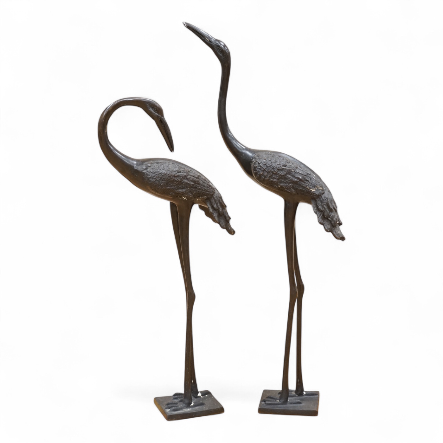 A pair of patinated bronze cranes, 62cm